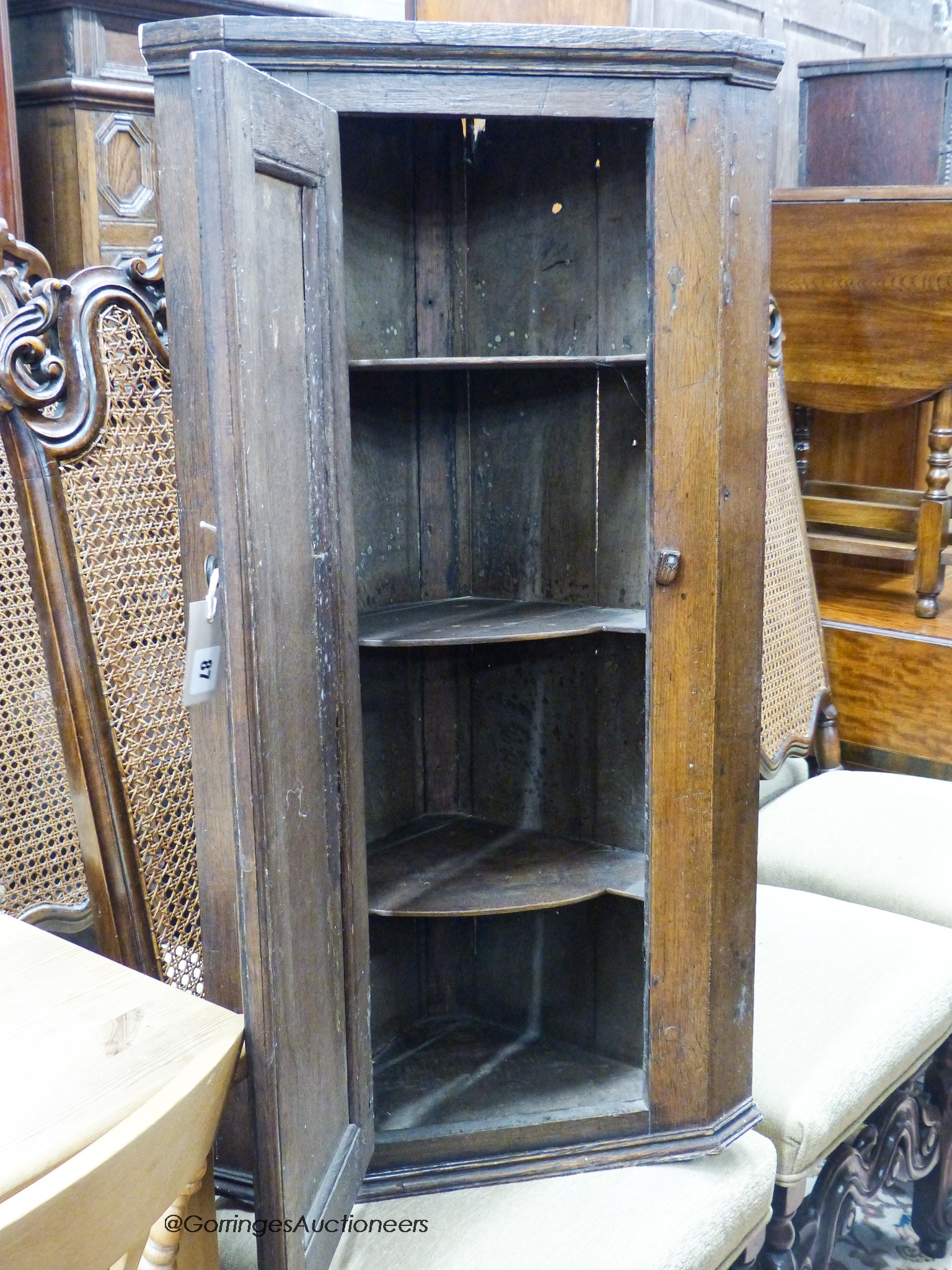 An 18th century and later oak corner cupboard, width 53cm, depth 30cm, height 101cm